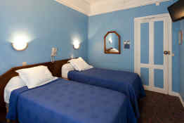 Ambassadeur Hotel • Guest Room