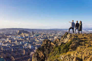 Salisbury Crags in Holyrood Park, with view of Edinburgh Castle