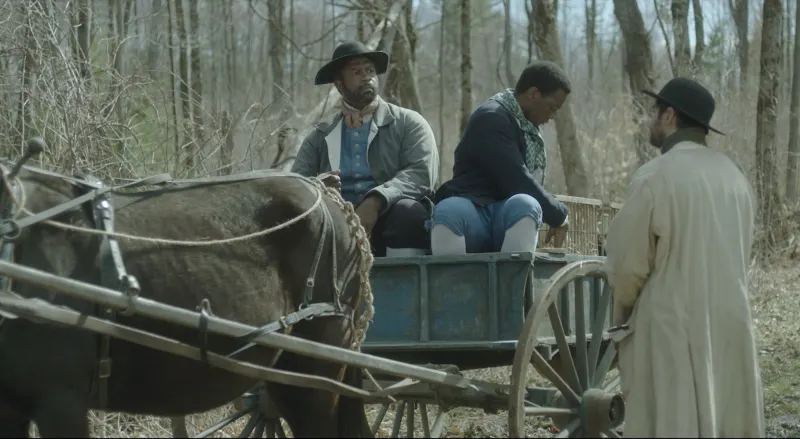 full shot of Prince family in wagon