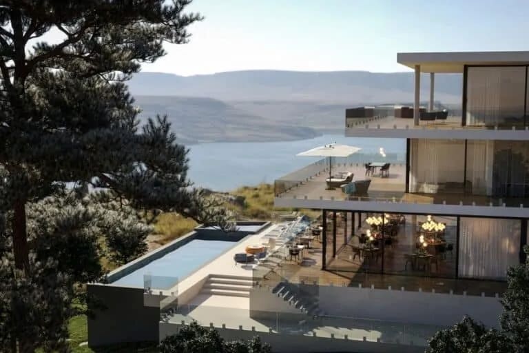Rambarde de terrasse en verre transparent posée sur un muret pour une sécurité optimale et élégante.