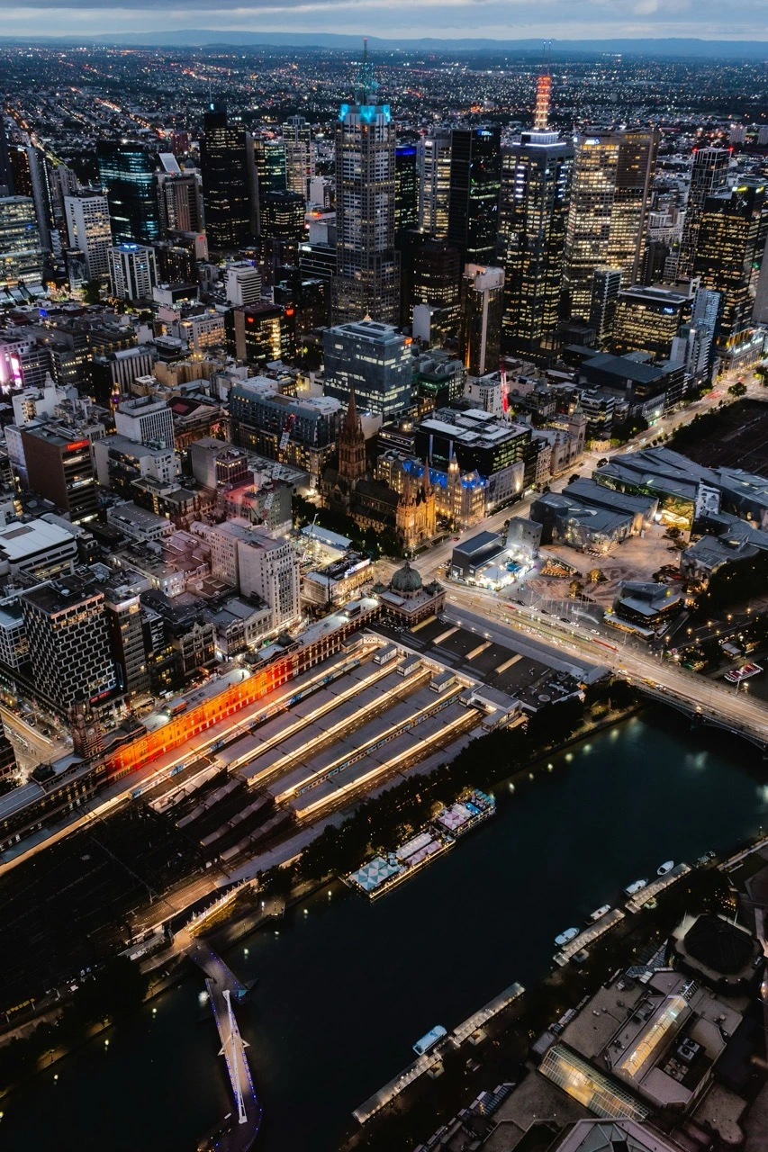 Melbourne CBD and the Yarra from the air at night, ME CABS serving Southbank day and night