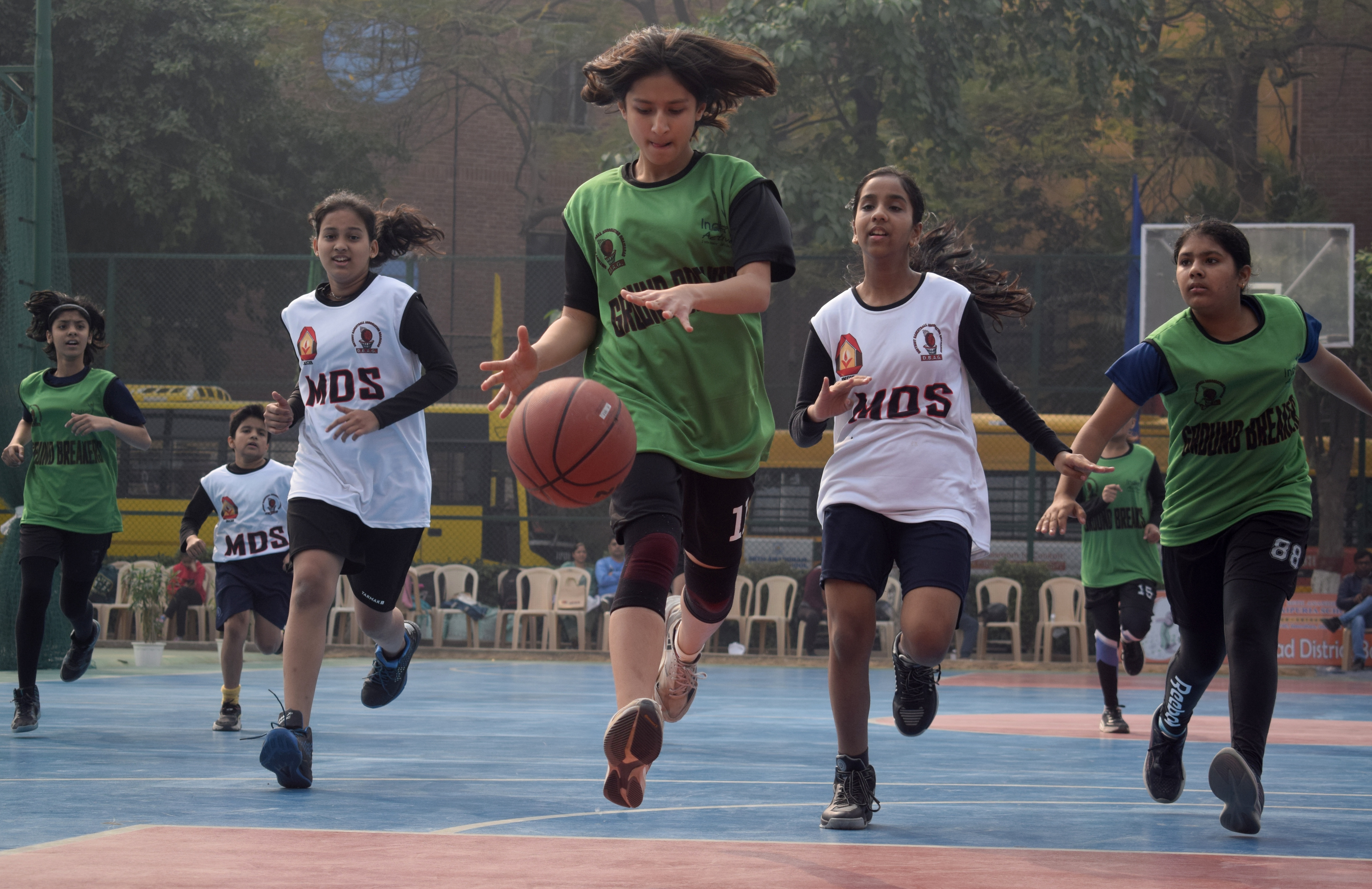 Youth playing basketball - Building Character Shaping Futures