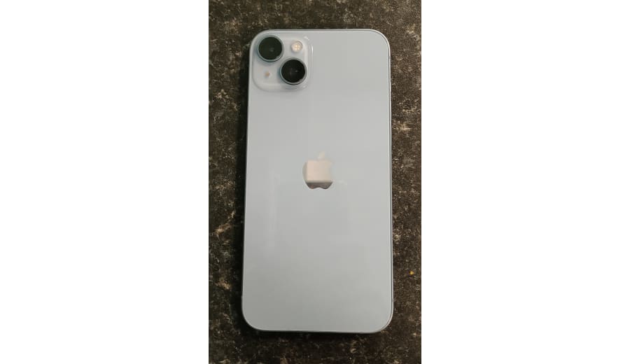iPhone 14 Plus — iPhone 14 Plus, Blue, rear, flat on a stone countertop