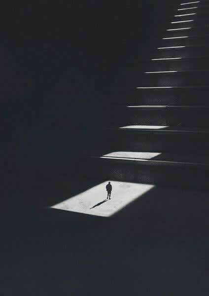 Solitary Light on Dark Stairs — phone wallpaper preview