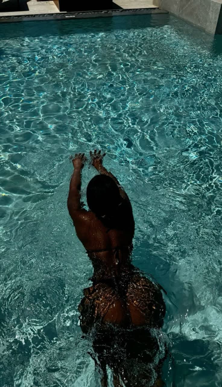 Refreshing Swim in Blue Pool — phone wallpaper preview
