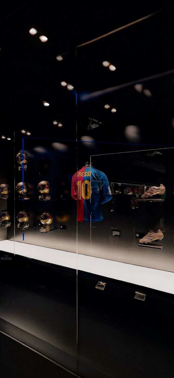 Messi's Golden Legacy Display — phone wallpaper