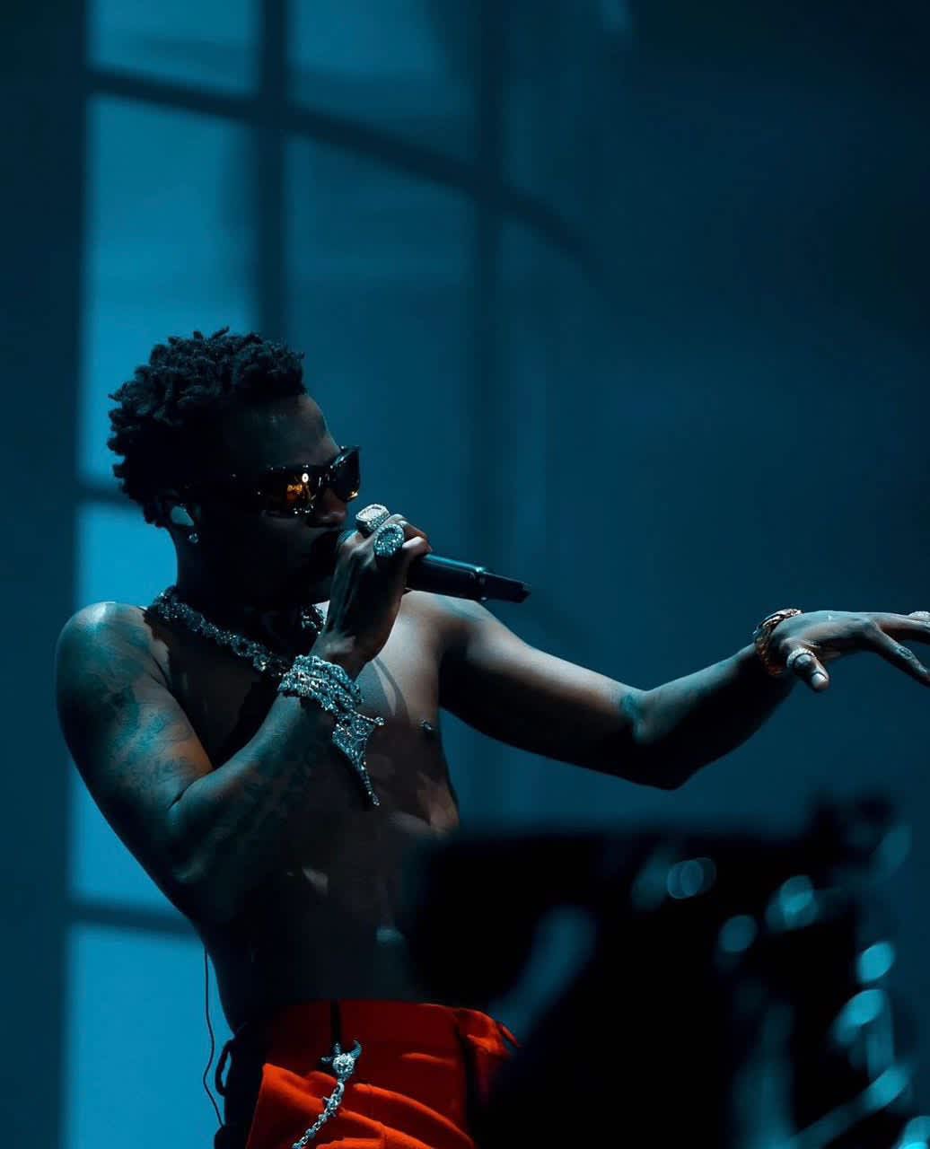Wizkid Stage Presence Blue Glow — phone wallpaper preview