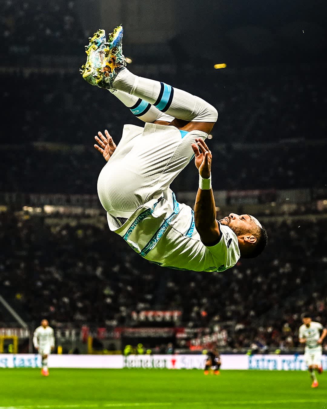 Dynamic Soccer Player Backflip Celebration — phone wallpaper preview