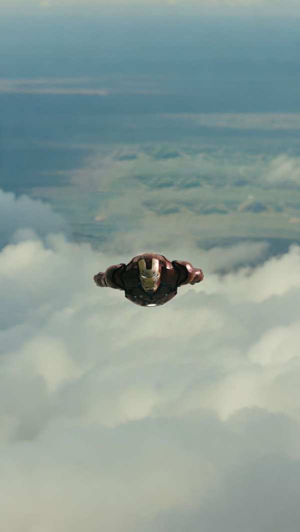 Iron Man Soars Above Clouds — phone wallpaper