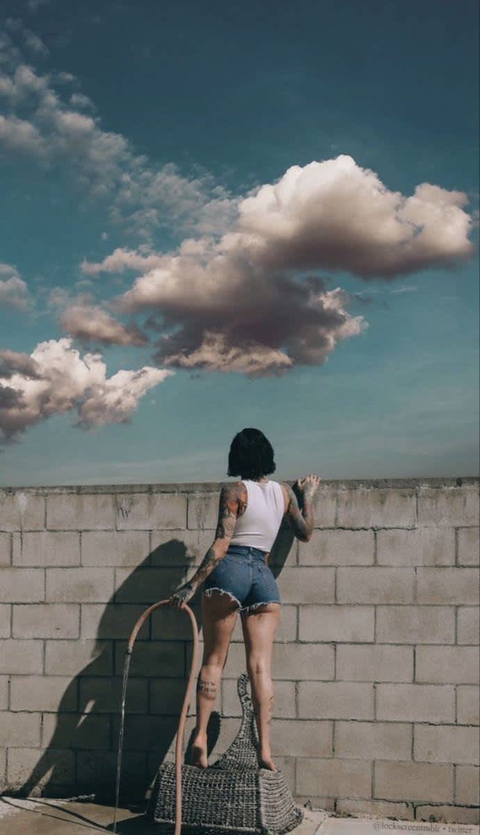 Skyward Gaze Over Wall — phone wallpaper preview