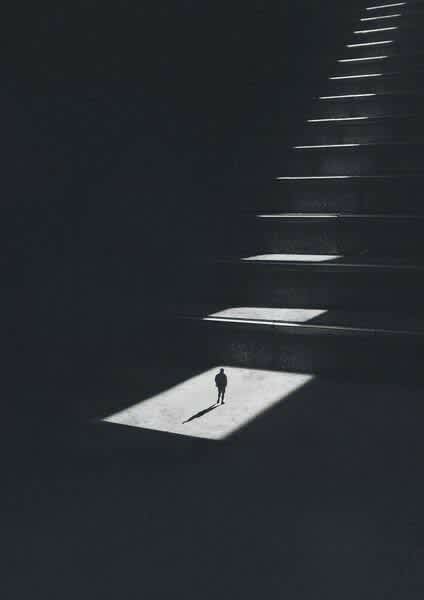 Solitary Figure on Illuminated Steps — phone wallpaper