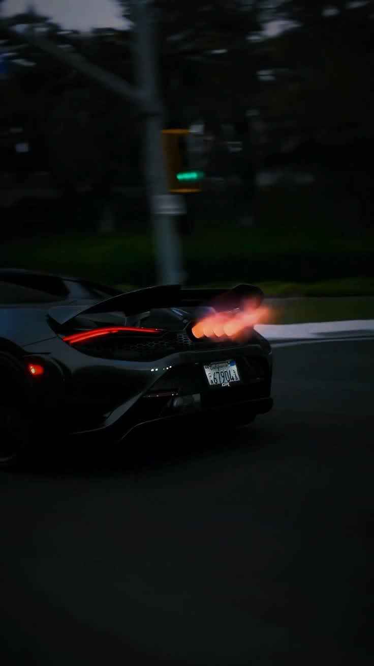 Dynamic McLaren Exhaust Glow — phone wallpaper preview