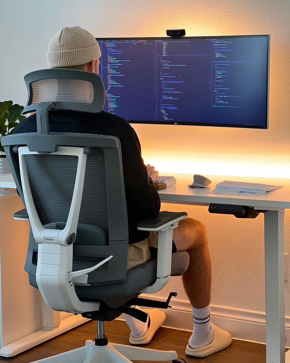 Focused Programmer's Warm Desk Setup — phone wallpaper preview