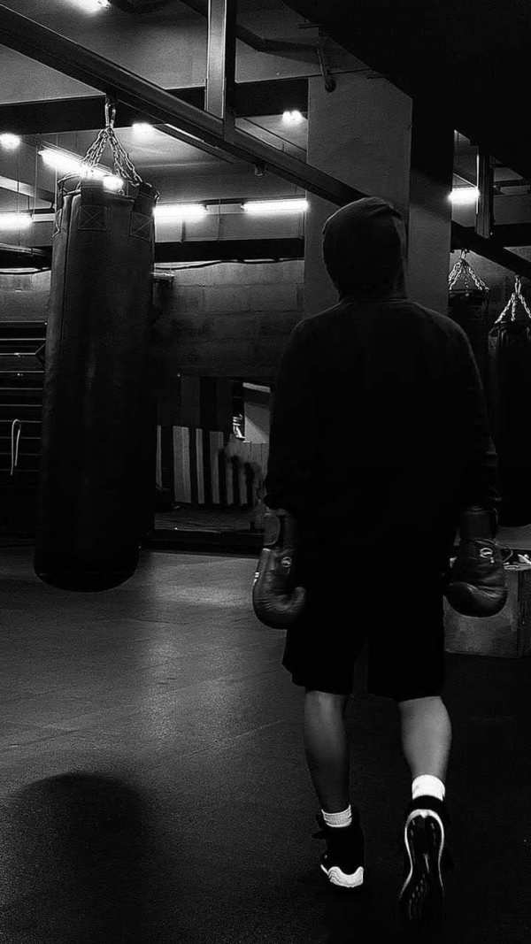 Determined Boxer in Gym — phone wallpaper