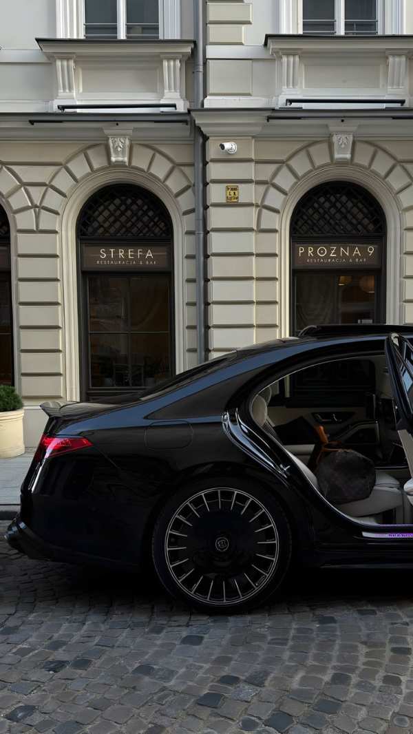 Sleek Black Luxury Car Urban Elegance — phone wallpaper