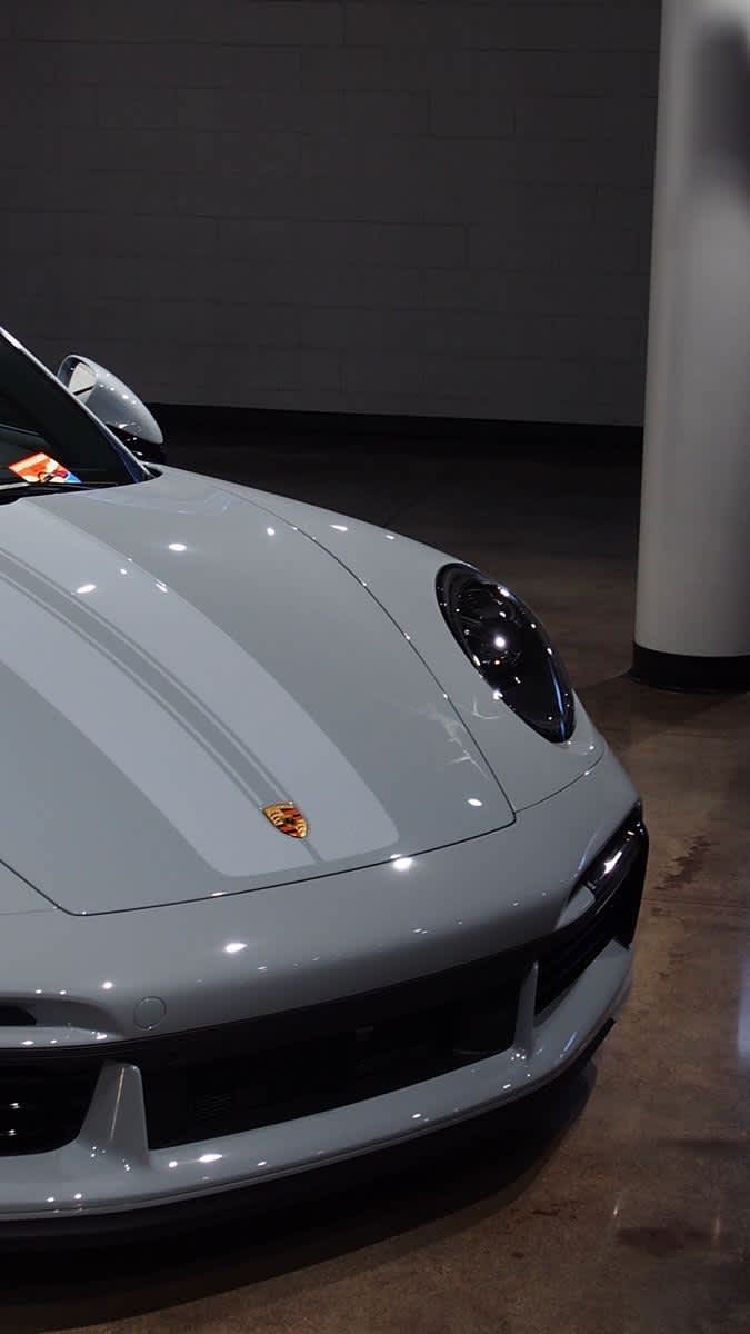 Sleek Grey Porsche Front View — phone wallpaper preview
