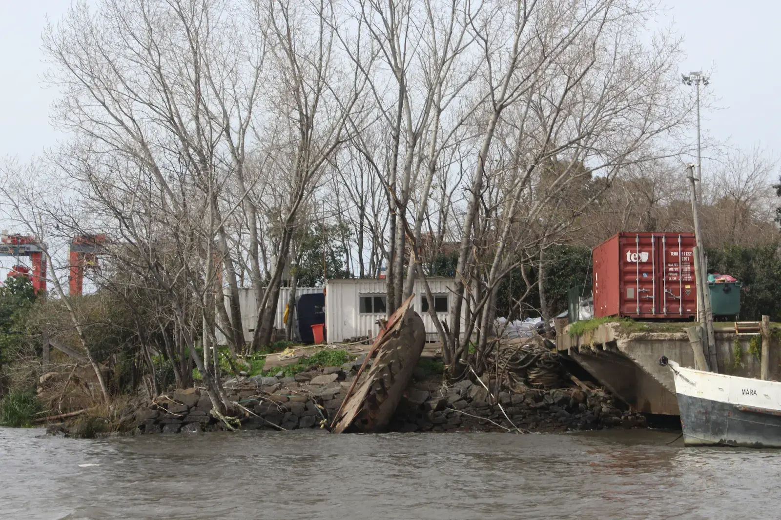The shoreline of the river is not only contaminated with household and industrial garbage, but also larger objects like abandoned vehicles and boats, 2023.