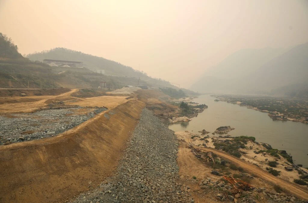 Construction work is taking place on a mountainside next to the Luang Prabang hydroelectric dam, about 25 km from the historical tourist city of Luang Prabang in Laos. Many trees were cut down to make way for construction equipment and machinery.