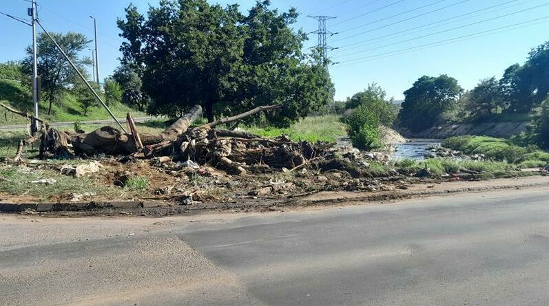 The low-lying bridge is continually clogged with debris that causes flooding when it rains.