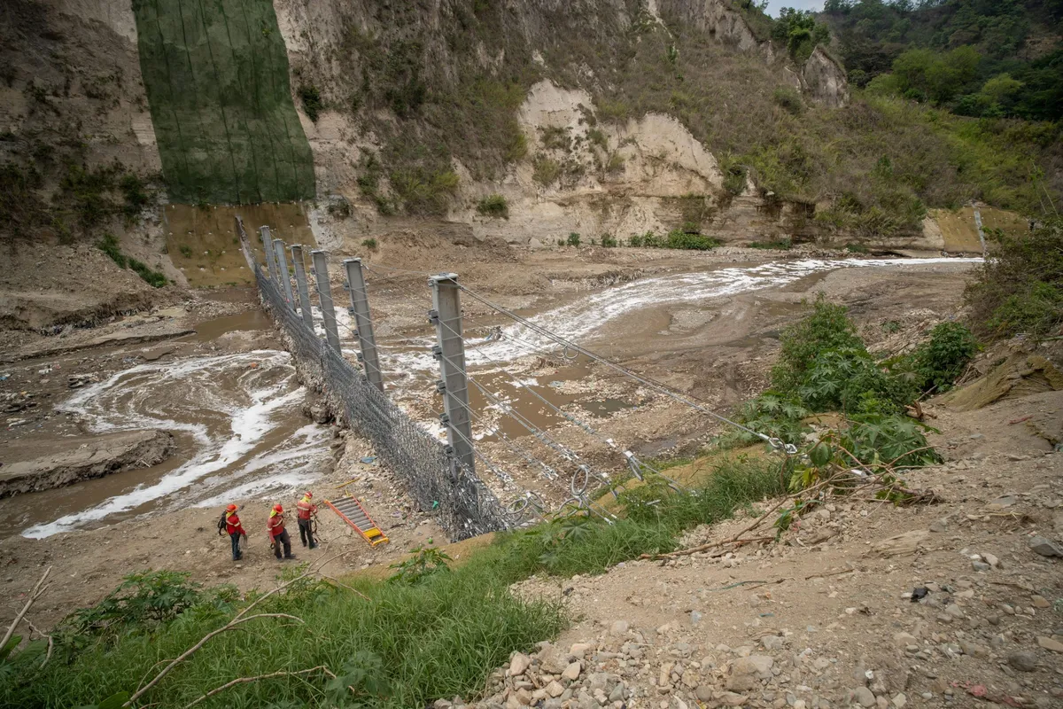 Installation of Interceptor 006, The Ocean Cleanup's first Trashfence. Rio Las Vacas, Guatemala.