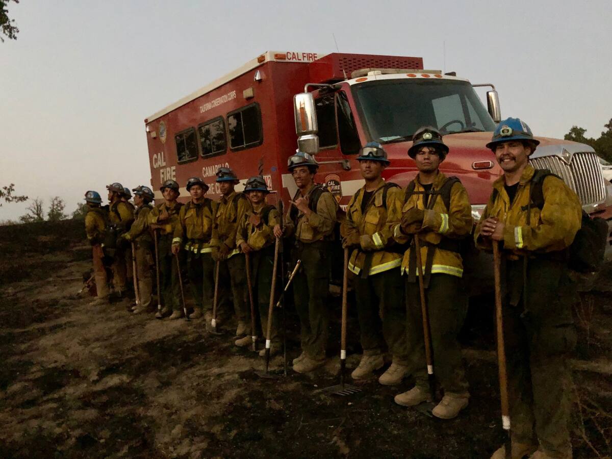 SCU Lightning Complex fire.  In this photo, a crew of firefighters from the Camarillo Fire Center stands in front of an engine after a shift.