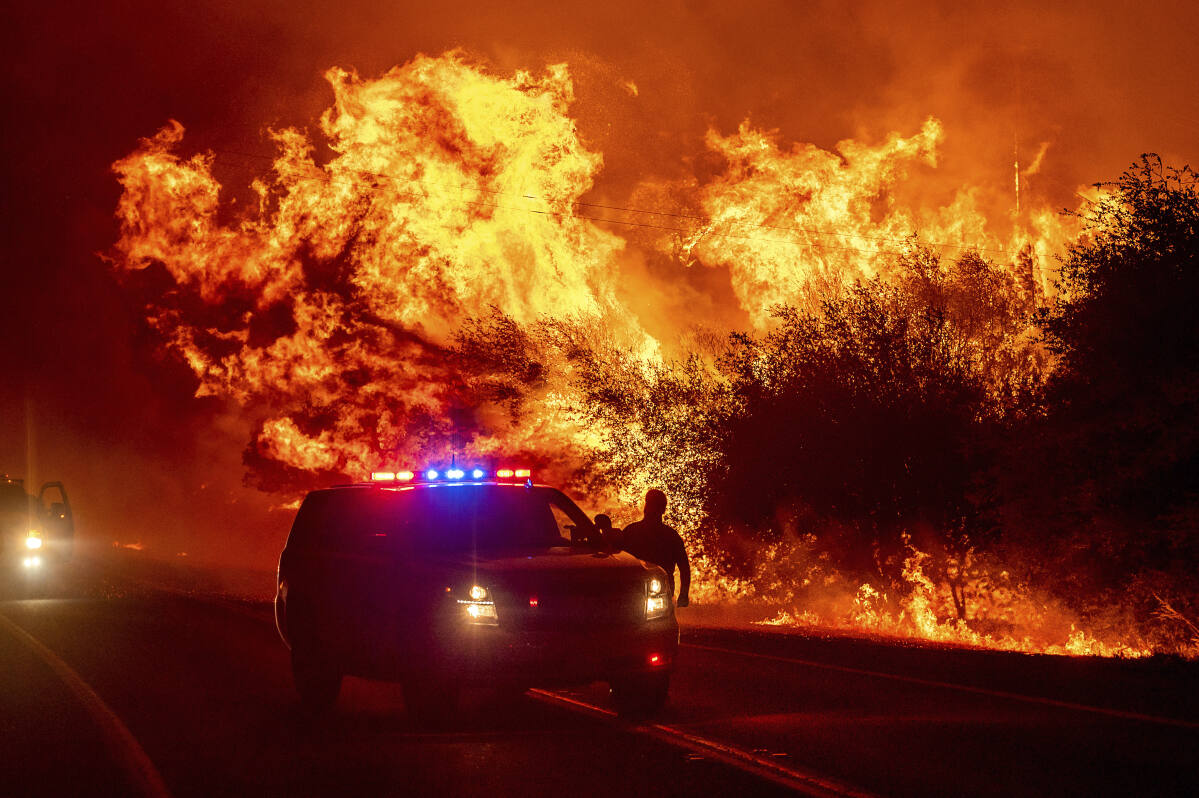 North Complex fire. In this photo, the Hennessey fire traps fire crews in an open turnout along Knoxville Berryessa Road on Aug. 19, 2020 as several fires merge together in the Lake Berryessa area of the LNU Lightning Complex.