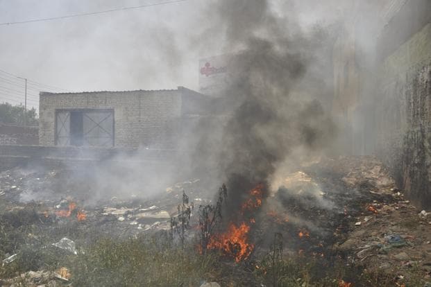 Air pollution in Gurugram from burning garbage.