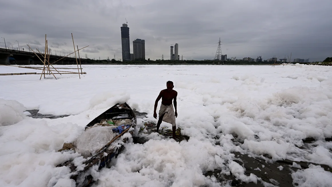 Yamuna river – a tributary of the holy Ganges River covered with a thick layer of toxic foam due to water pollution near Kalindi Kunj, on September 10, 2023 in New Delhi, India.
