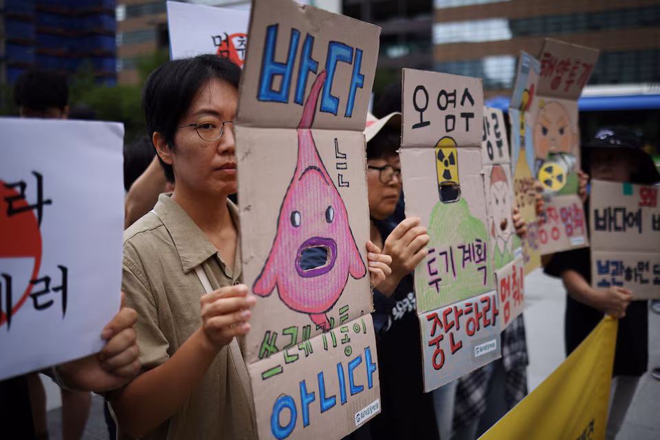 Activists attend a protest at the National Assembly in Seoul, August 24, 2023.