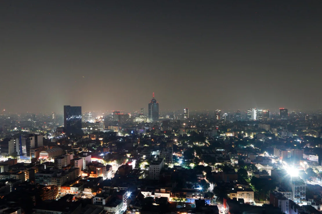 Smoke and pollution hangs over in Mexico City, early Thursday, May 16, 2019.