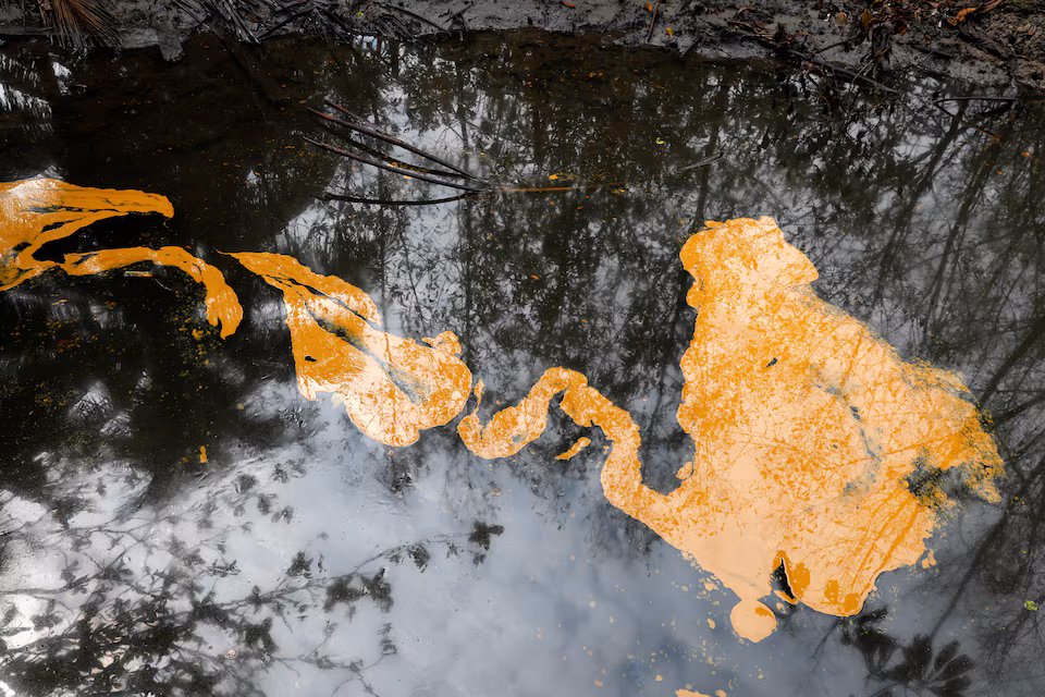 An oil slick is seen on Santa Barbara creek, following an oil spill in Nembe, Bayelsa, Nigeria, November 25, 2021. Picture taken November 25, 2021.