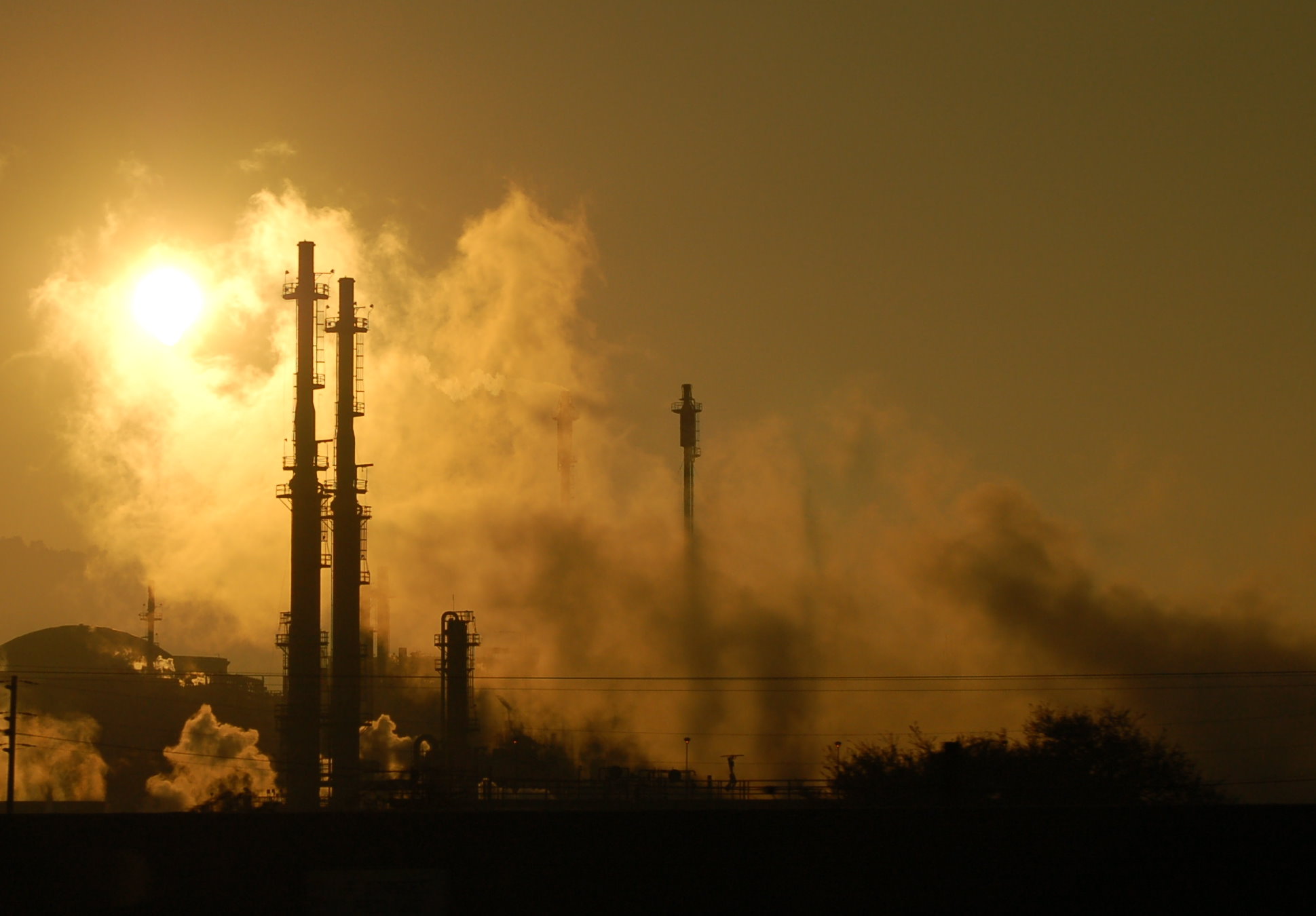 Smoke from a fire at a chemical plant. Environmental problem, air pollution.