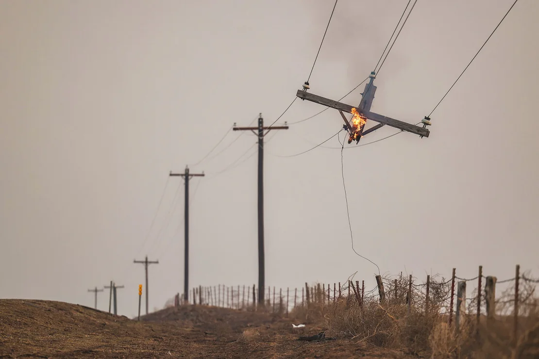 A telephone pole burns from the Smokehouse Creek Fire on February 28 in Canadian, Texas.