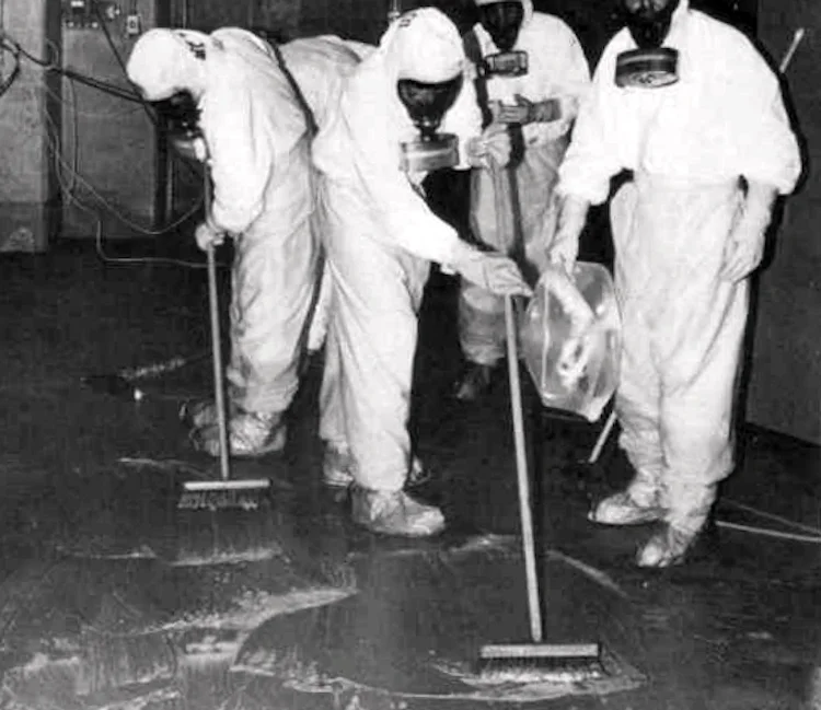 Three Mile Island personnel clean up radioactive contamination in the auxiliary building. 1979.