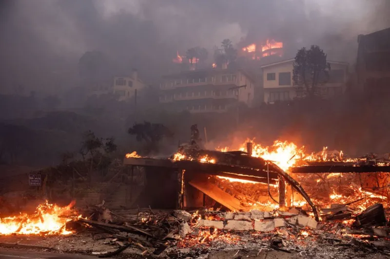 Beachfront and hillside homes in Malibu, CA burn in the Palisades Fire on Wednesday, January 8, 2025