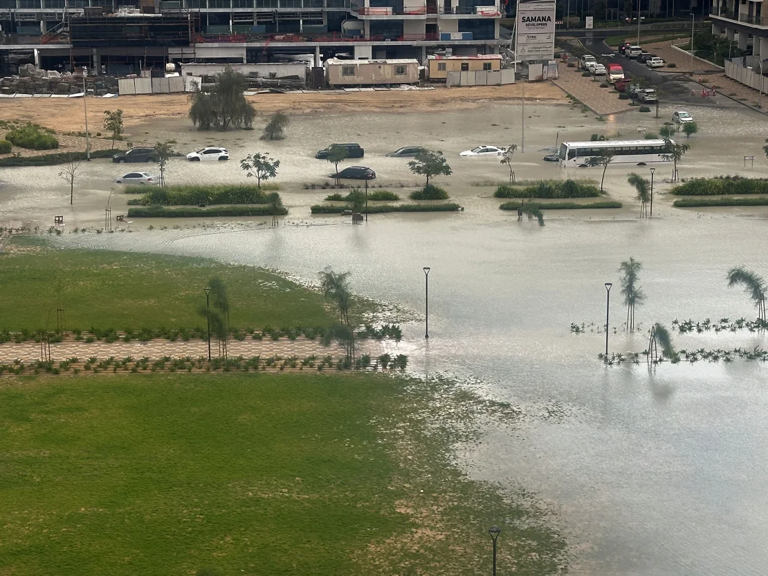 Cars drive through a flooded street in Dubai, United Arab Emirates, on April 16, 2024