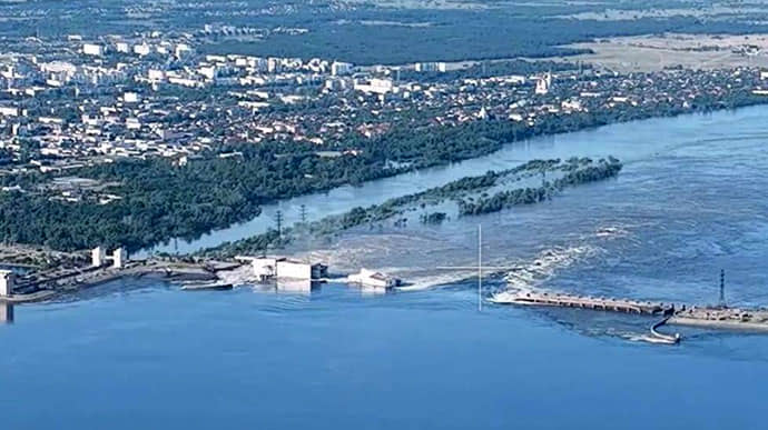 Water runs in a wide stream from the Kakhovka hydroelectric power station destroyed by the invaders. Kakhovka HPP before destruction