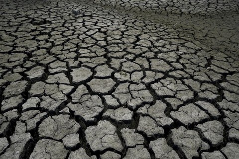 Dry, cracked soil is seen in the Boca reservoir, which supplies water to the northern city of Monterrey during a drought in Santiago, Mexico, July 9, 2022.