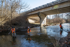 RAFT program volunteers sample and test water from Little Eagle Creek on Sunday, Dec. 12, 2021, on the west side of Indianapolis. The waterway connects to the White River