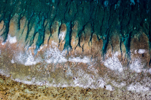 Waves from the Pacific Ocean crash onto Funafuti’s shoreline