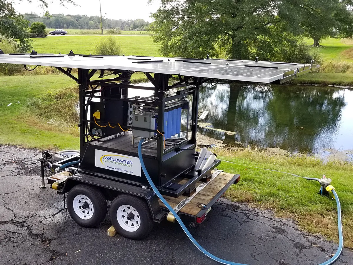 A solar-powered MaxPure system turns pond water into clean drinking water