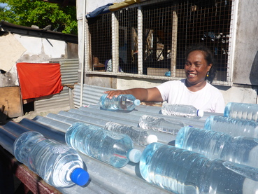 Lady uses SODIS water treatment