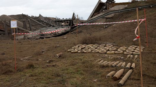 Unexploded ordnance and land mines are seen along the main road to Kherson in November 2022.