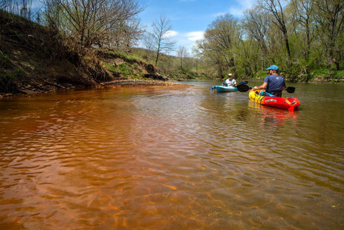 Coal ash waste from the shuttered Vermilion Power Station seeps into the Middle Fork of the Vermilion River near Collison, Illinois in 2018.
