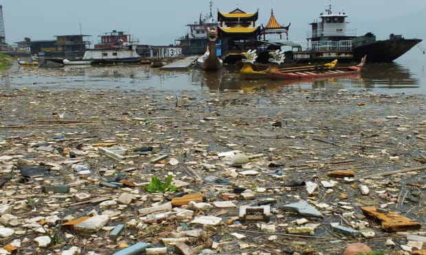 Rubbish floats in the Yangtze at Yichang. Pollution is a major factor in the decline of wild sturgeon in the river.