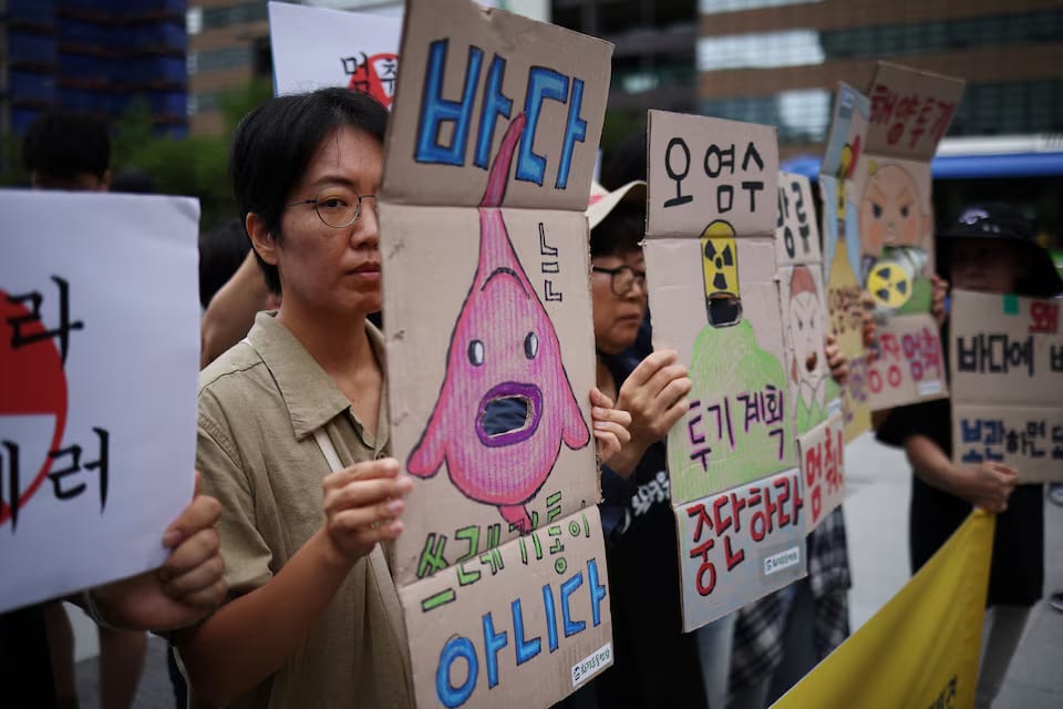 Activists attend a protest at the National Assembly in Seoul, August 24, 2023.