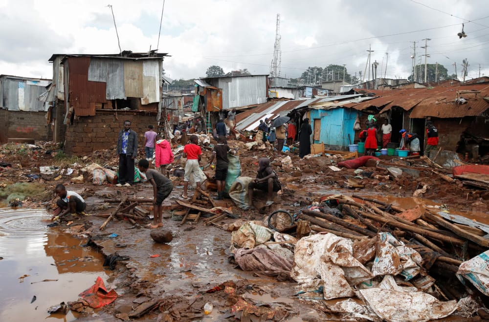 Residents sift through the rubble as they recover their belongings after the Nairobi river burst its banks and destroyed their homes within the Mathare Valley settlement in Nairobi, Kenya April 25.