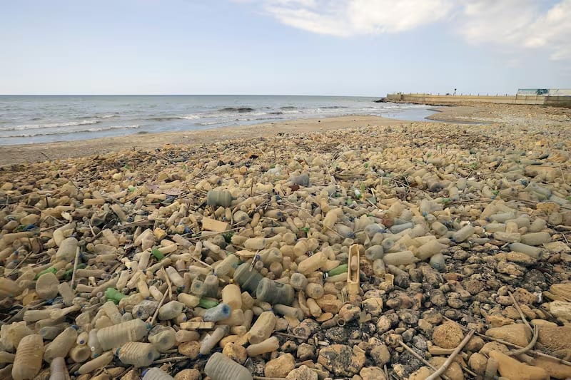 Piles of plastic waste are pictured on the seaside in the coastal town of Khalde, south of the Lebanese capital Beirut.