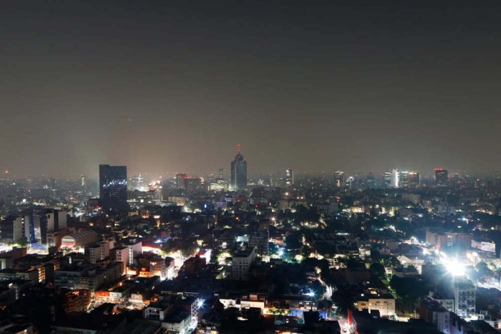 Smoke and pollution hangs over in Mexico City, early Thursday, May 16, 2019.