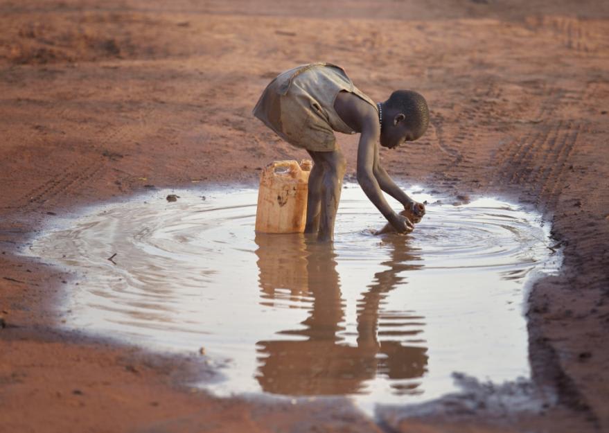 Most women and children have to walk miles a day to a distant water source.